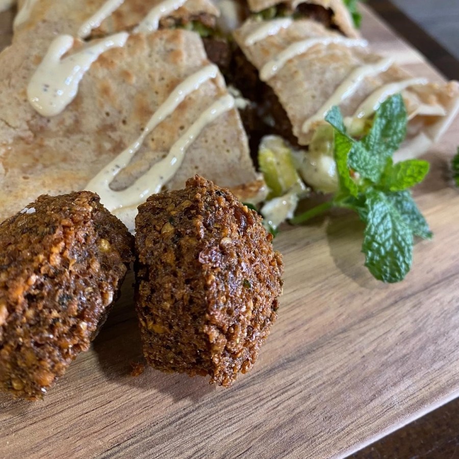 Falafel and fresh vegetables served with tahini